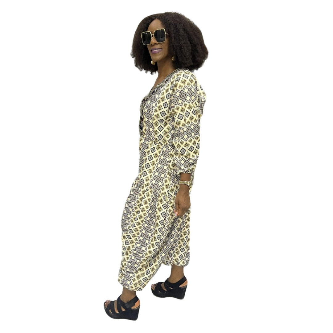 Palazzo Jumpsuit featuring a cream and black geometric diamond print, an embellished V-neckline, and a voluminous drop-crotch silhouette.