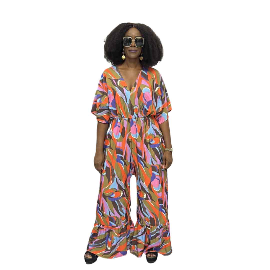 Palazzo Jumpsuit featuring a colorful abstract wave print, V-neckline, and wide legs with tiered ruffled hems.