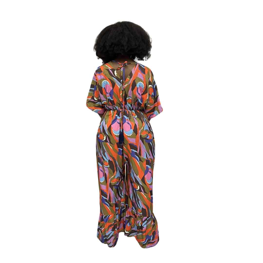 Palazzo Jumpsuit featuring a colorful abstract wave print, V-neckline, and wide legs with tiered ruffled hems.