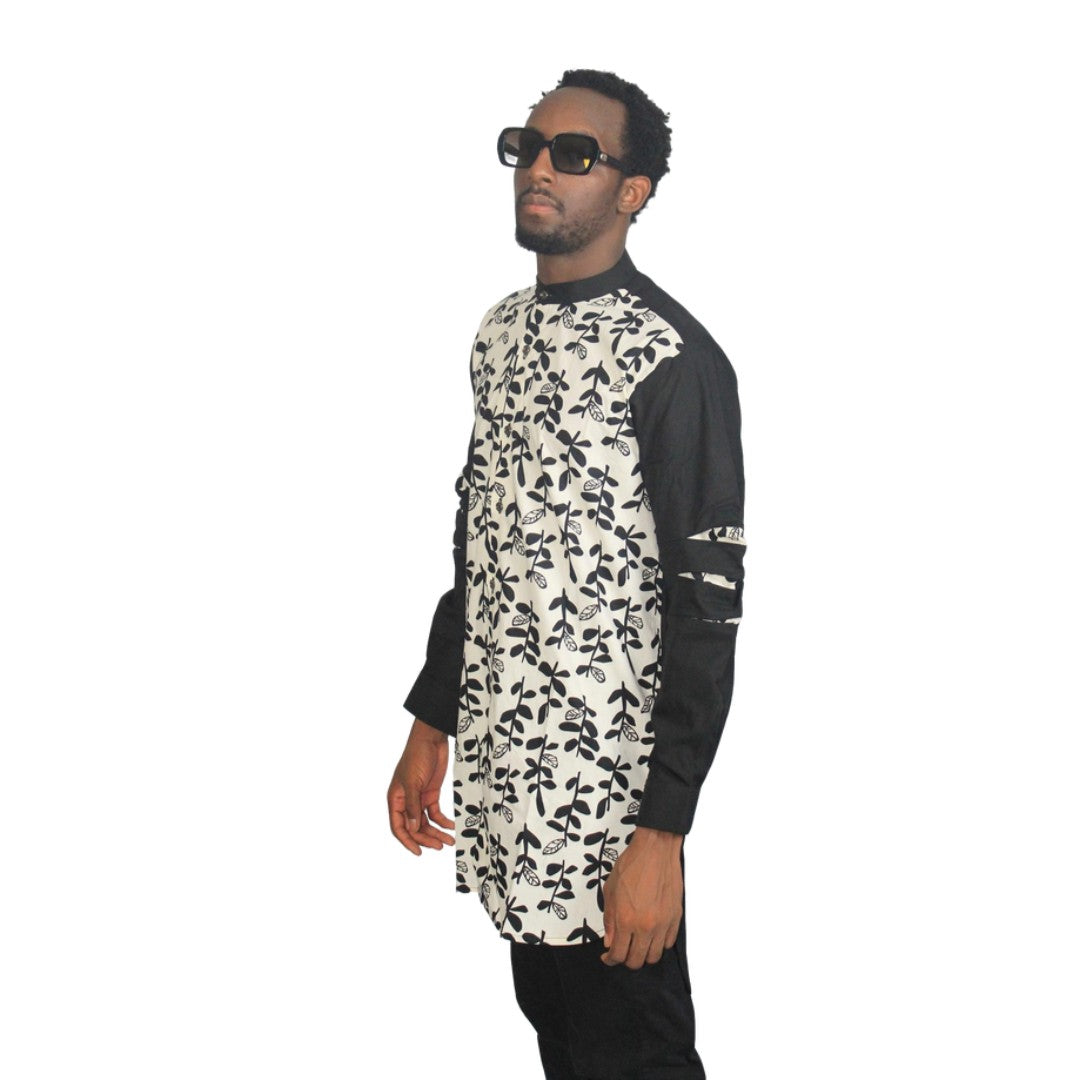 Patterned Shirtfeaturing a black and white floral leaf pattern on the torso with contrasting solid black long sleeves and a mandarin collar. Side