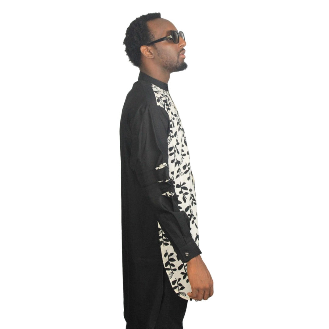 Patterned Shirt featuring a black and white floral leaf pattern on the torso with contrasting solid black long sleeves and a mandarin collar. Side View