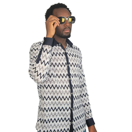 Patterned Shirtfeaturing a black and white mesh zigzag pattern, a dark contrasting button placket, and matching dark cuffs.