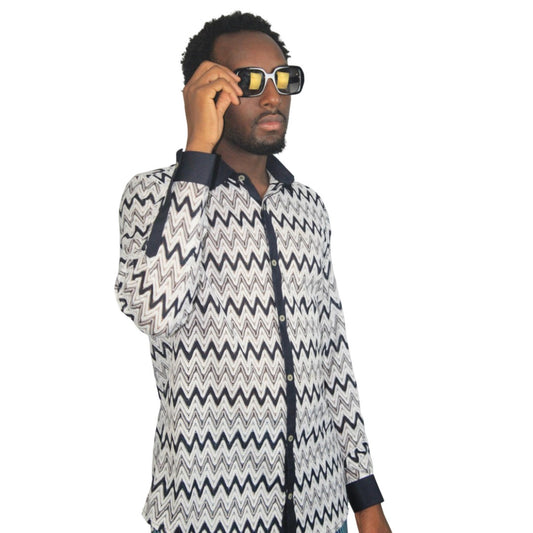 Patterned Shirtfeaturing a black and white mesh zigzag pattern, a dark contrasting button placket, and matching dark cuffs.
