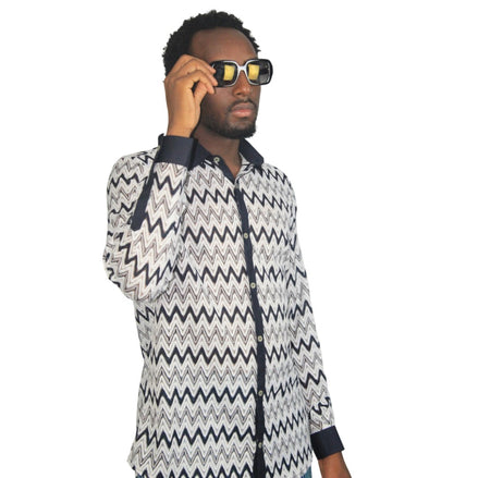 Patterned Shirtfeaturing a black and white mesh zigzag pattern, a dark contrasting button placket, and matching dark cuffs.