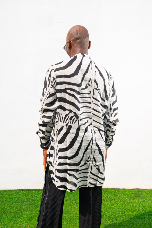 Patterned Shirt featuring a long-sleeve white tunic with bold black zebra-inspired patterns, a buttoned neckline, and a straight hem. Back View
