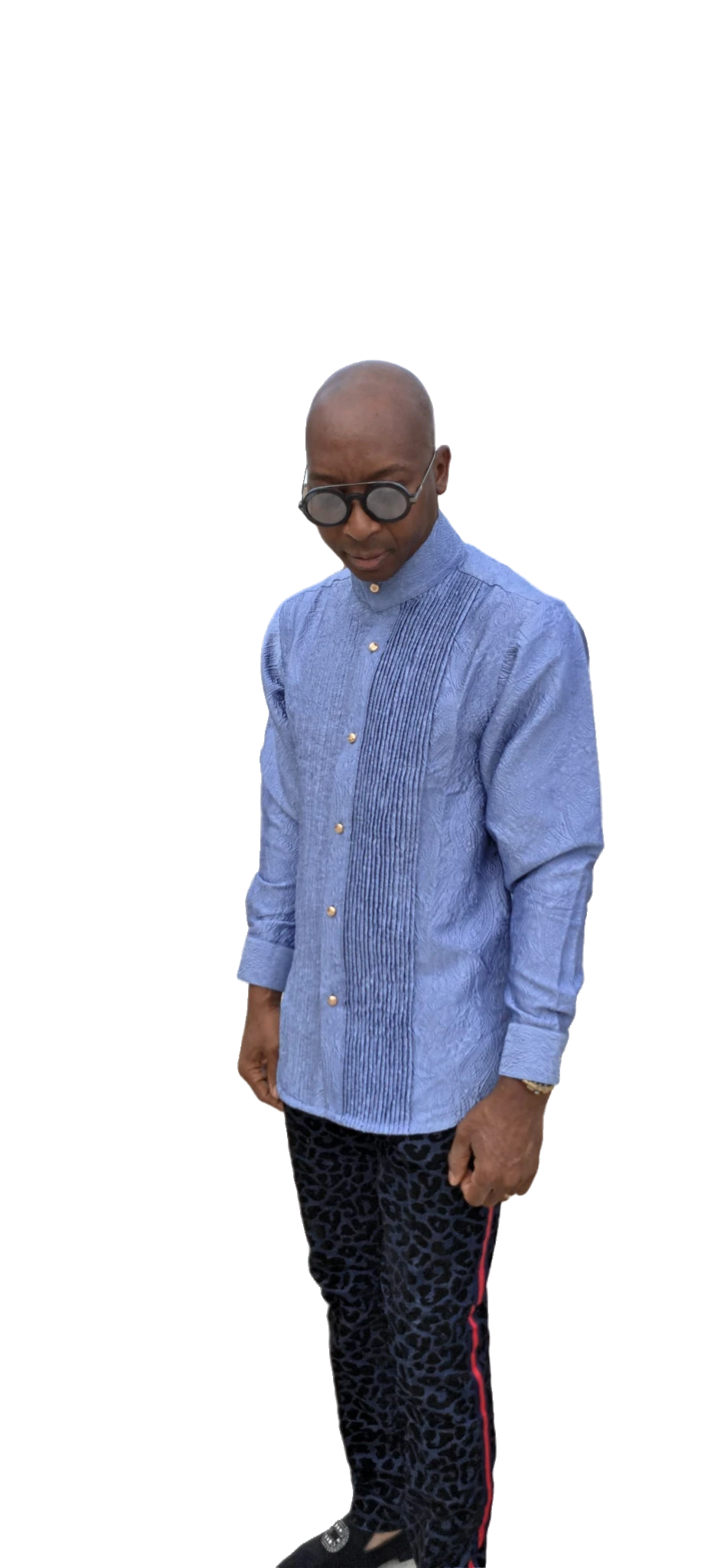 Senator-Style Shirt featuring dusty blue textured jacquard fabric, vertical central pleating, high mandarin collar, and buttoned long-sleeve silhouette.