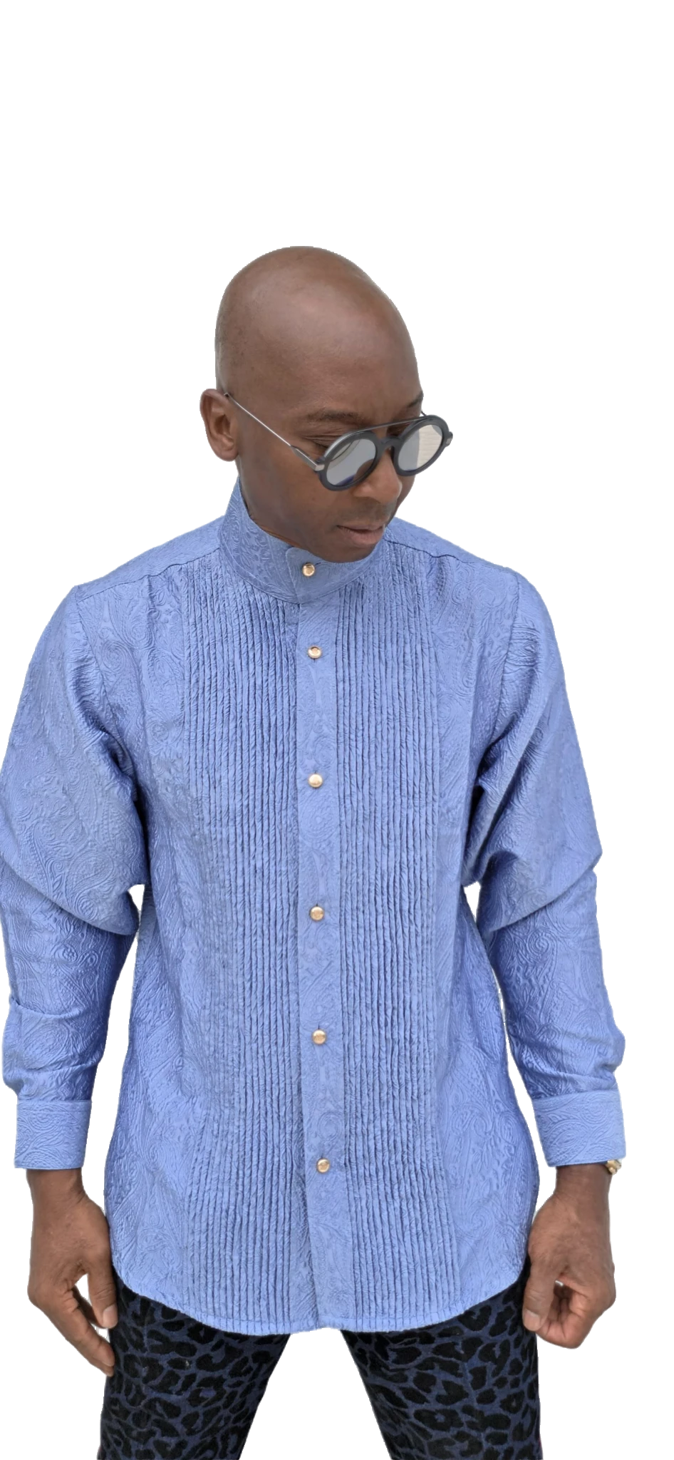Senator-Style Shirt featuring dusty blue textured jacquard fabric, vertical central pleating, high mandarin collar, and buttoned long-sleeve silhouette.