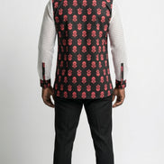 Shirt featuring a long-sleeved silhouette with a black and coral-pink floral Ankara print torso, accented by white mesh net sleeves with matching printed cuffs.