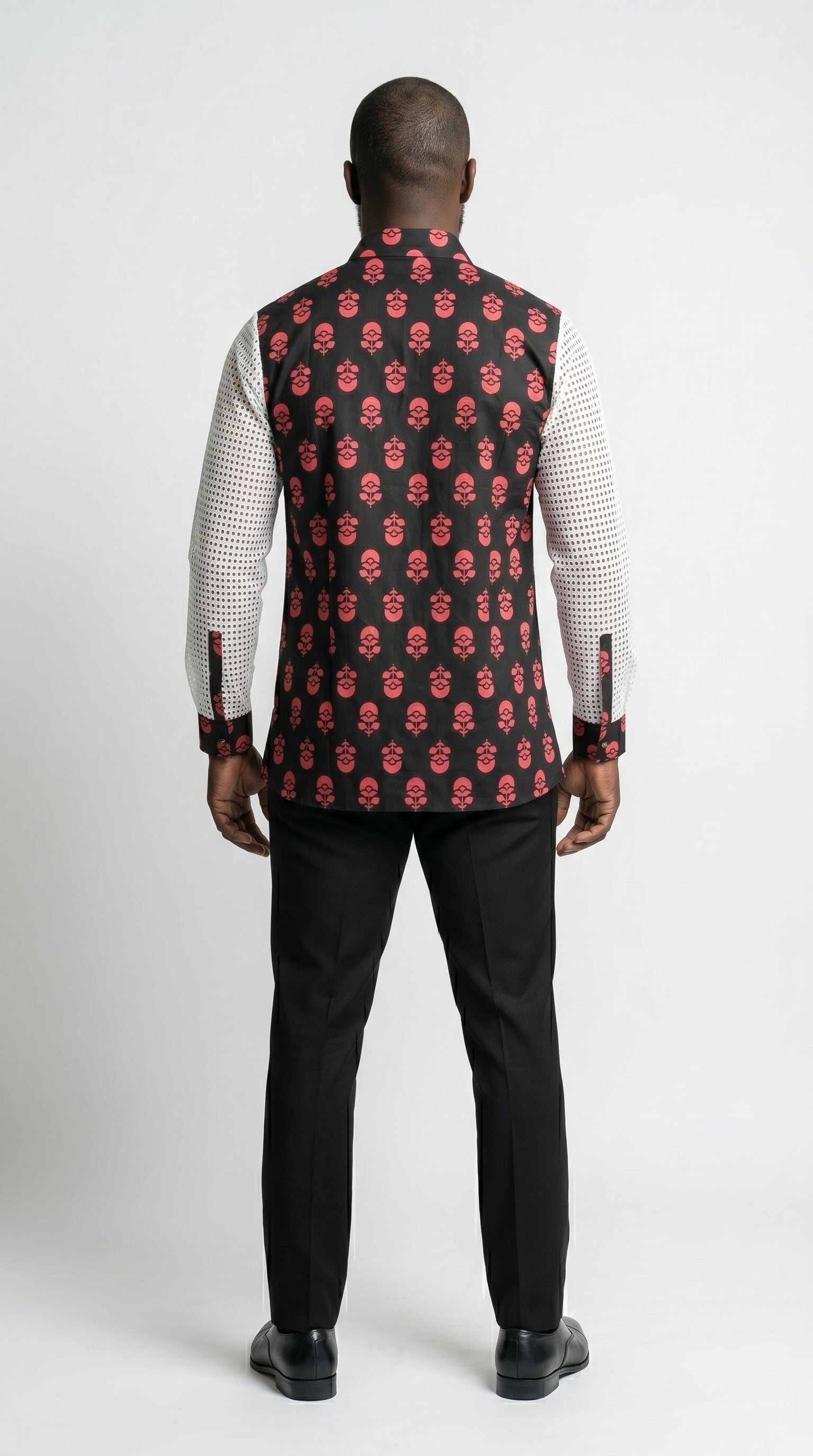 Shirt featuring a long-sleeved silhouette with a black and coral-pink floral Ankara print torso, accented by white mesh net sleeves with matching printed cuffs.