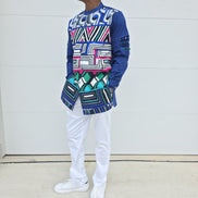 Shirt featuring an abstract geometric front panel in bright pink, teal, blue, and black-and-white lines, finished with navy blue sleeves that display three horizontal pleated cutouts.