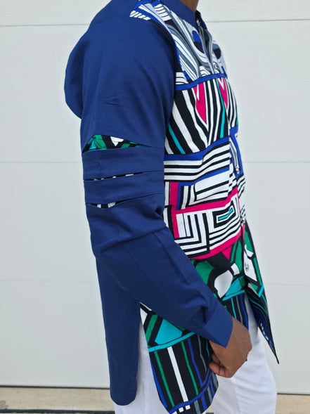 Shirt featuring an abstract geometric front panel in bright pink, teal, blue, and black-and-white lines, finished with navy blue sleeves that display three horizontal pleated cutouts.