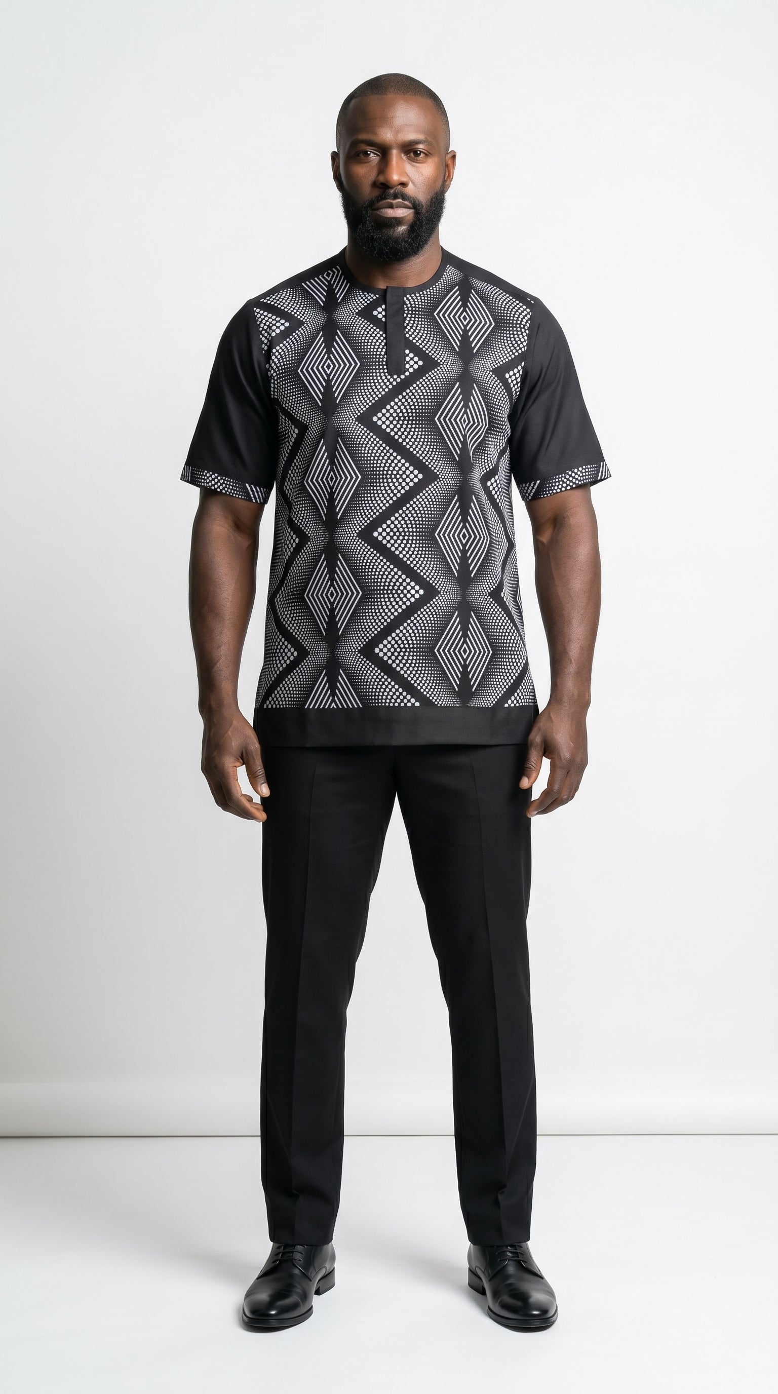 Shirt featuring a short-sleeved silhouette with a black and white optical diamond Ankara print on the chest, contrasted by solid black sleeves, collar, and side panels.