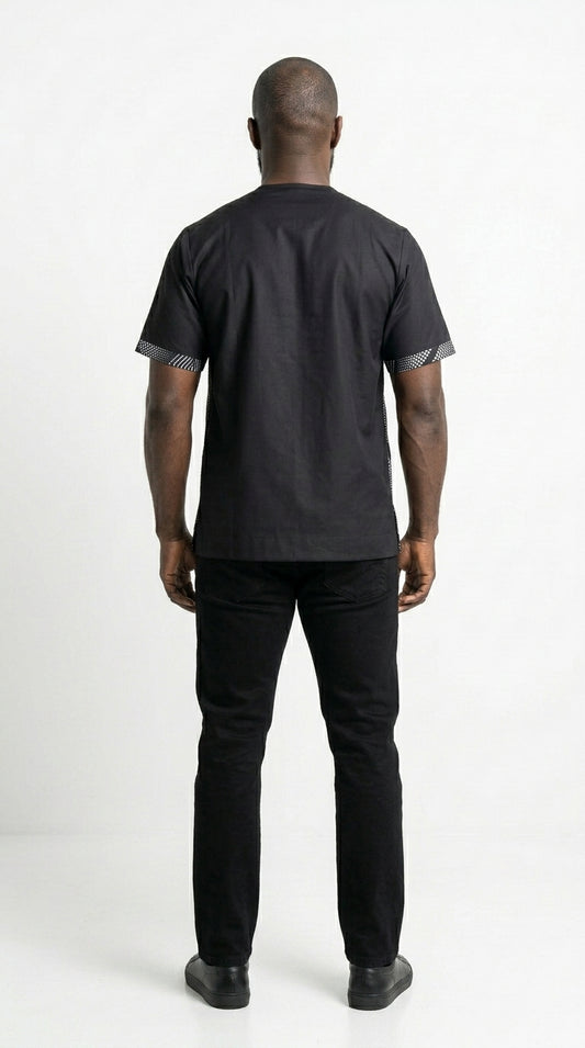 Shirt featuring a short-sleeved silhouette with a black and white optical diamond Ankara print on the chest, contrasted by solid black sleeves, collar, and side panels.