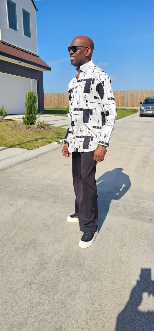 Shirt featuring a black and white geometric abstract print, a structured high half collar, and elongated double cuffs.
