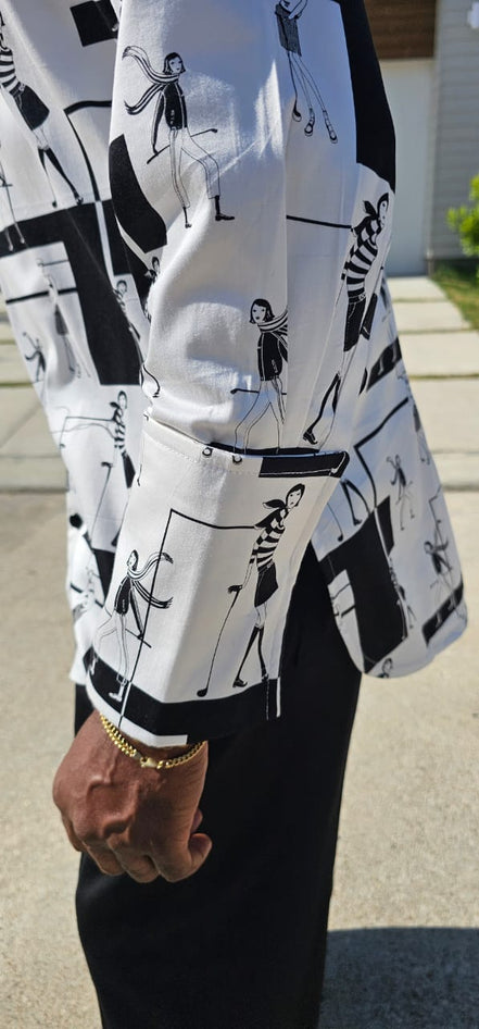 Shirt featuring a black and white geometric abstract print, a structured high half collar, and elongated double cuffs.