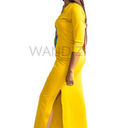 Tank Dress featuring a fitted yellow V-neck maxi dress adorned with a central multi-colored geometric African print map patch on the chest and high side slits