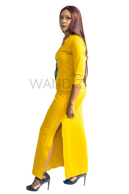 Tank Dress featuring a fitted yellow V-neck maxi dress adorned with a central multi-colored geometric African print map patch on the chest and high side slits