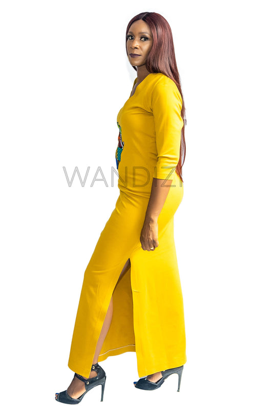 Tank Dress featuring a fitted yellow V-neck maxi dress adorned with a central multi-colored geometric African print map patch on the chest and high side slits