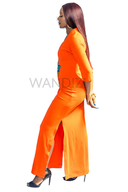 Tank Dress featuring a fitted orange V-neck maxi dress adorned with a central multi-colored geometric African print map patch on the chest and high side slits