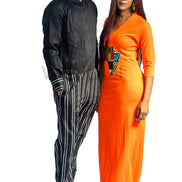 Tank Dress featuring a fitted orange V-neck maxi dress adorned with a central multi-colored geometric African print map patch on the chest and high side slits