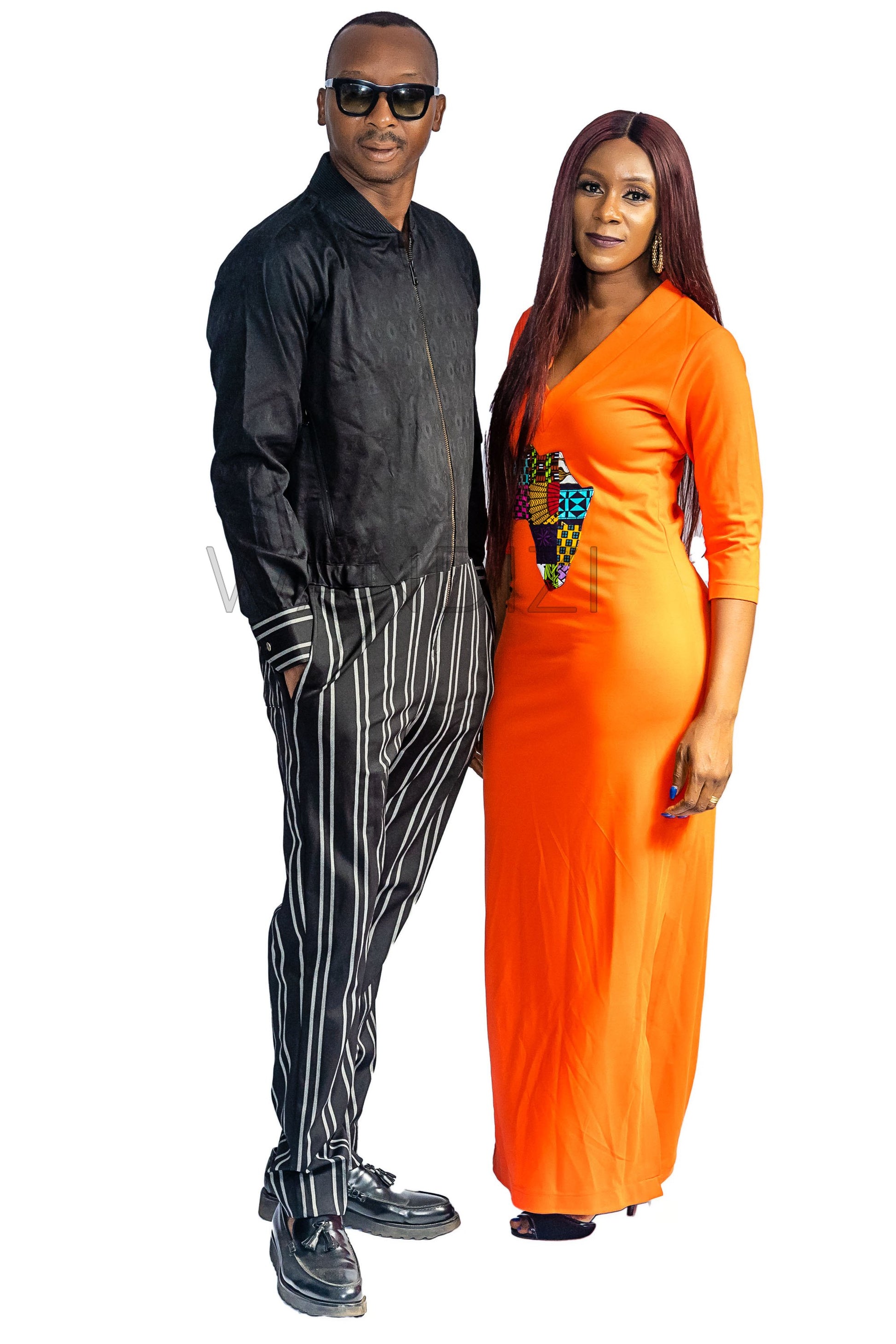 Tank Dress featuring a fitted orange V-neck maxi dress adorned with a central multi-colored geometric African print map patch on the chest and high side slits