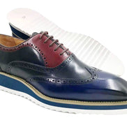 This hybrid dress shoe combines a traditional wingtip brogue upper with a contemporary white ripple sole. 