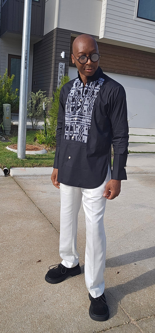 Top featuring a long-sleeved black tunic design with a geometric black-and-white print front panel and a high mandarin collar.