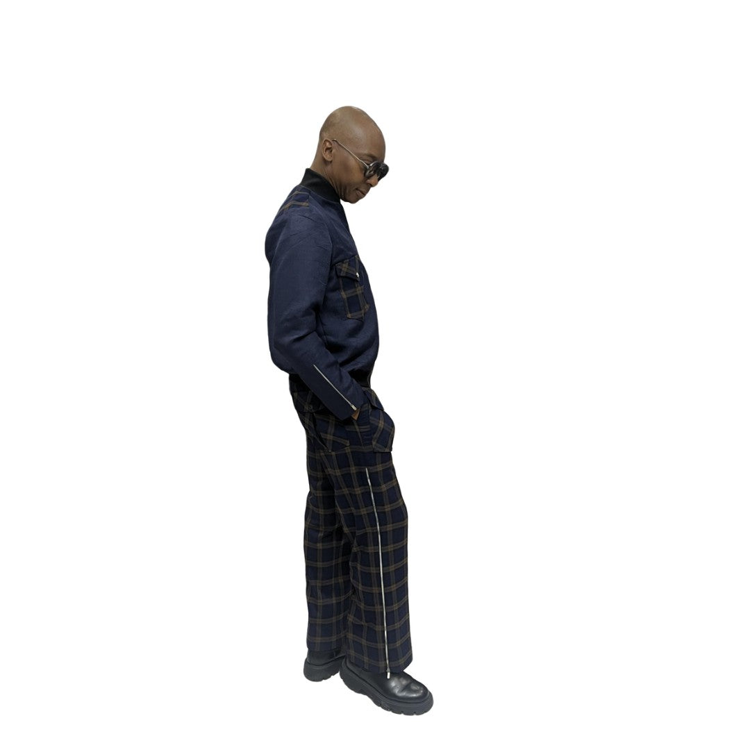 Tracksuit featuring a dark blue zip-up jacket with plaid pocket accents and matching plaid trousers with a side cargo pocket