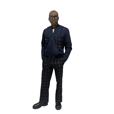 Tracksuit featuring a dark blue zip-up jacket with plaid pocket accents and matching plaid trousers with a side cargo pocket