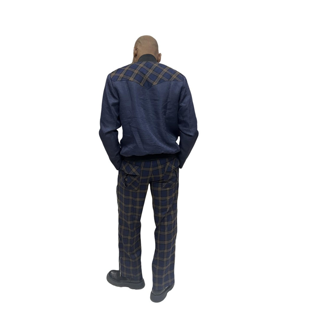 Tracksuit featuring a dark blue zip-up jacket with plaid pocket accents and matching plaid trousers with a side cargo pocket