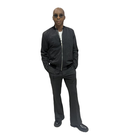 Tracksuit featuring a black bomber-style jacket with patterned sleeve accents and matching transformer pants with side-zip detailing