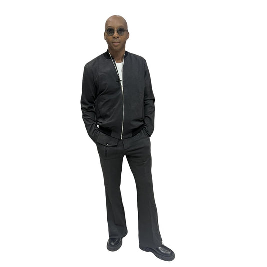 Tracksuit featuring a black bomber-style jacket with patterned sleeve accents and matching transformer pants with side-zip detailing
