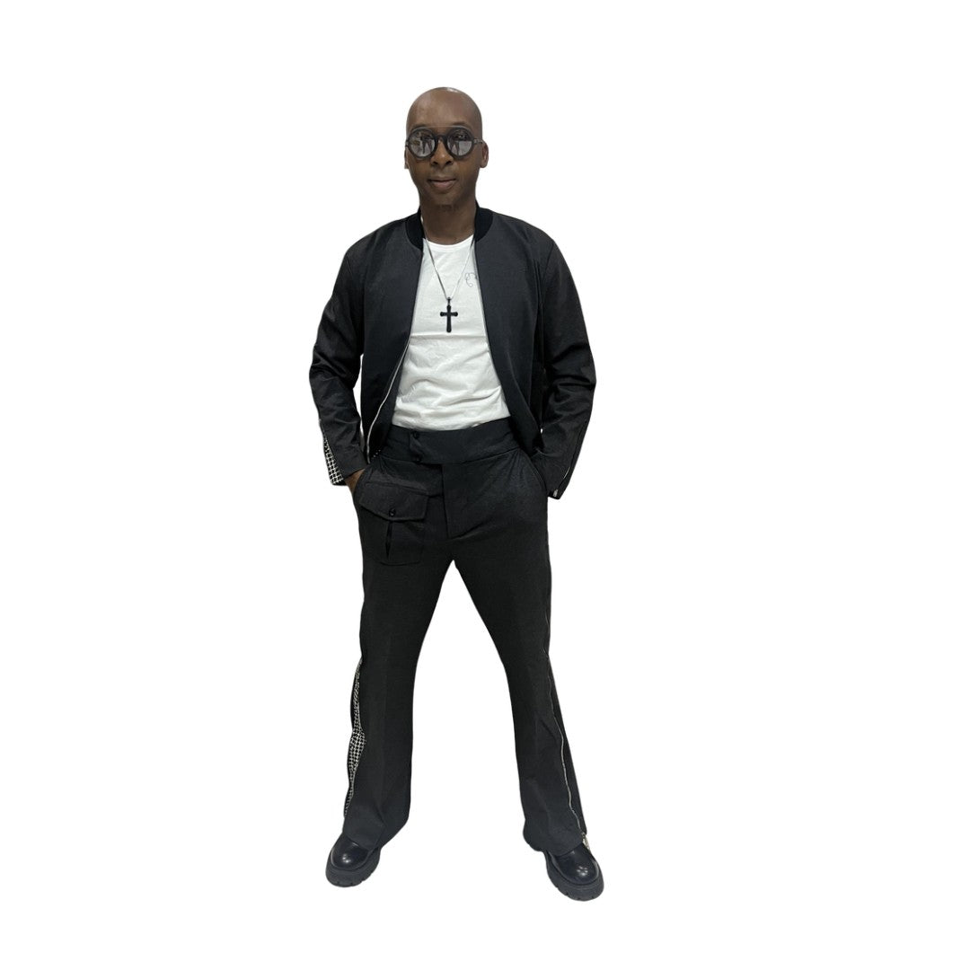 Tracksuit featuring a black bomber-style jacket with patterned sleeve accents and matching transformer pants with side-zip detailing
