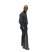 Tracksuit featuring a black bomber-style jacket with patterned sleeve accents and matching transformer pants with side-zip detailing