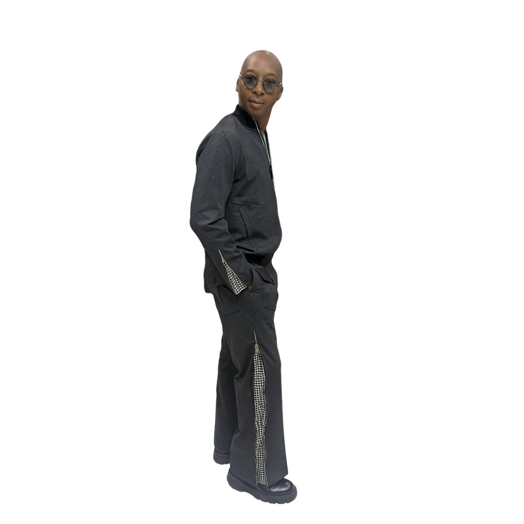 Tracksuit featuring a black bomber-style jacket with patterned sleeve accents and matching transformer pants with side-zip detailing