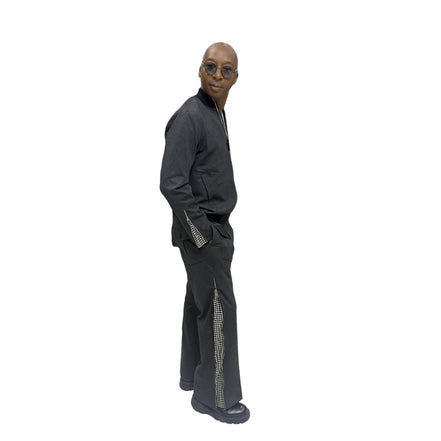 Tracksuit featuring a black bomber-style jacket with patterned sleeve accents and matching transformer pants with side-zip detailing
