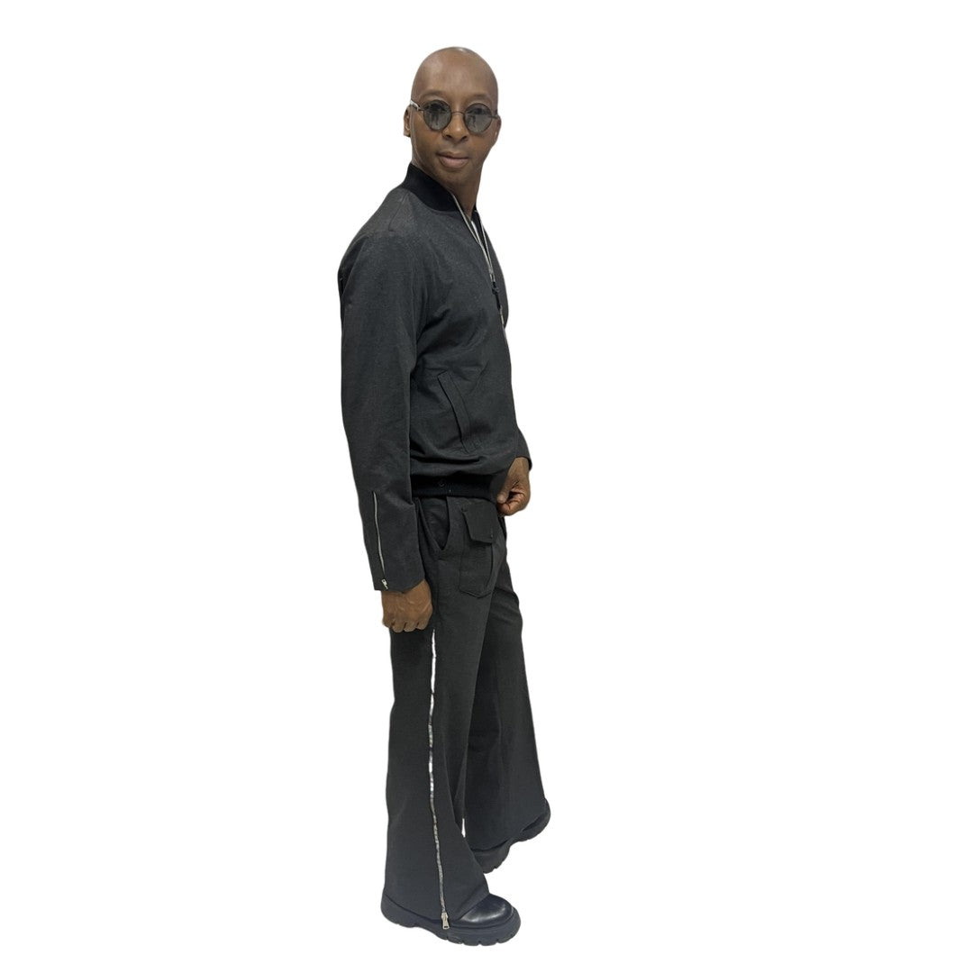 Tracksuit featuring a black bomber-style jacket with patterned sleeve accents and matching transformer pants with side-zip detailing