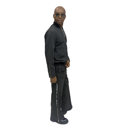 Tracksuit featuring a black bomber-style jacket with patterned sleeve accents and matching transformer pants with side-zip detailing