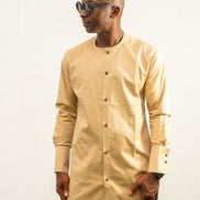 Traditional African outfit featuring a tan long-sleeved tunic with a round neckline, center-front button detailing, and matching structured trousers.