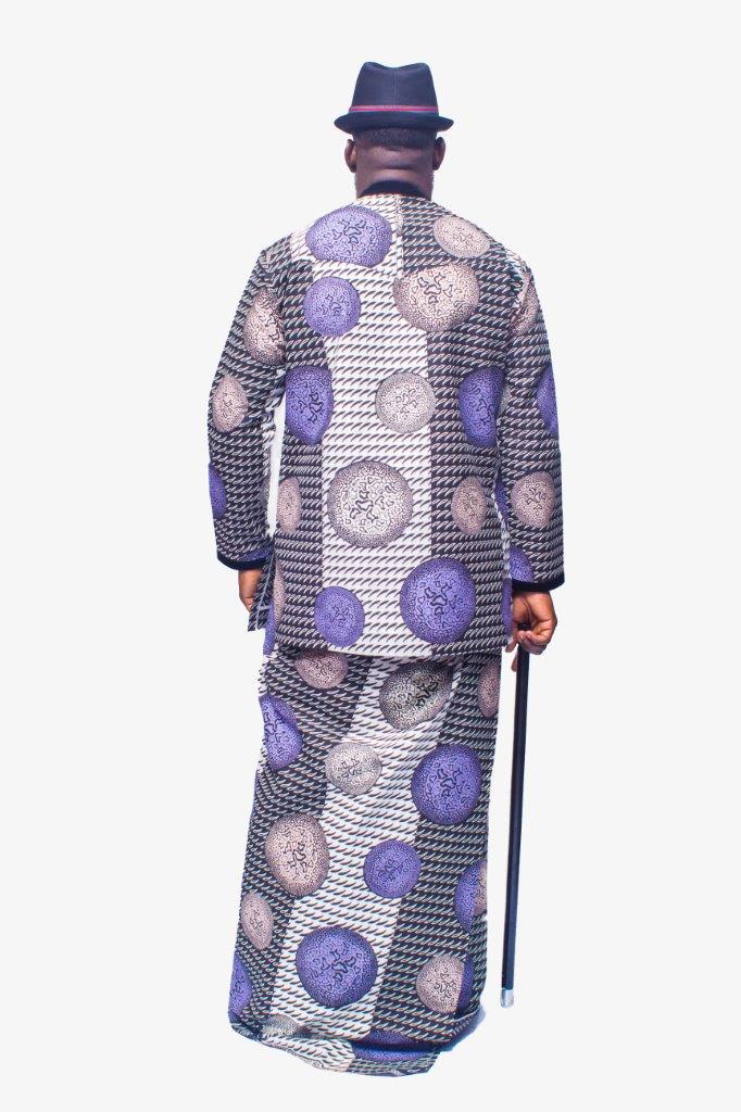 Two-Piece Set featuring a long-sleeved Ankara shirt and a matching traditional wrapper in a purple, silver, and black houndstooth pattern, finished with a black velvet collar and vertical chest placket
