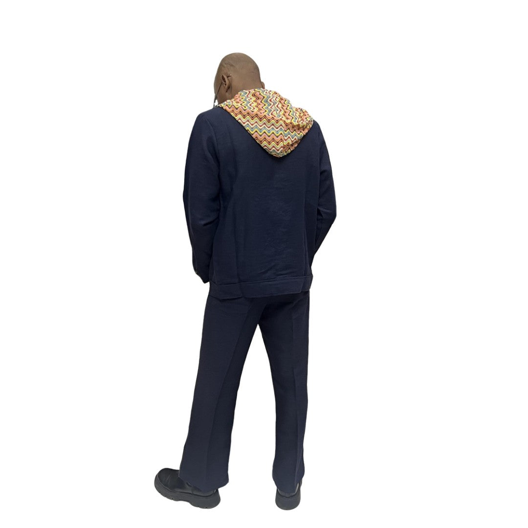 Two-Piece Set featuring a dark blue button-down hoodie with a colorful patterned hood lining and matching trousers