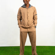 Two-Piece Set featuring a brown long-sleeved hooded shirt with blue patterned sleeve accents and matching straight-leg trousers.