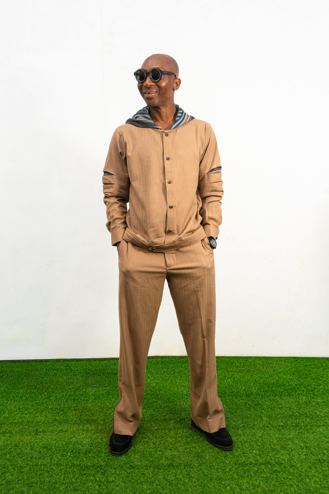 Two-Piece Set featuring a brown long-sleeved hooded shirt with blue patterned sleeve accents and matching straight-leg trousers.