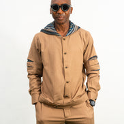 Two-Piece Set featuring a brown long-sleeved hooded shirt with blue patterned sleeve accents and matching straight-leg trousers.