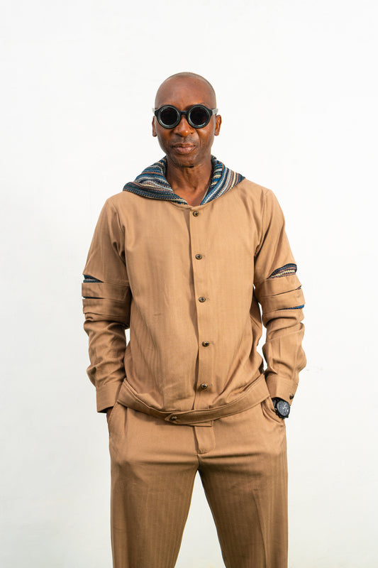 Two-Piece Set featuring a brown long-sleeved hooded shirt with blue patterned sleeve accents and matching straight-leg trousers.