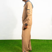 Two-Piece Set featuring a brown long-sleeved hooded shirt with blue patterned sleeve accents and matching straight-leg trousers.