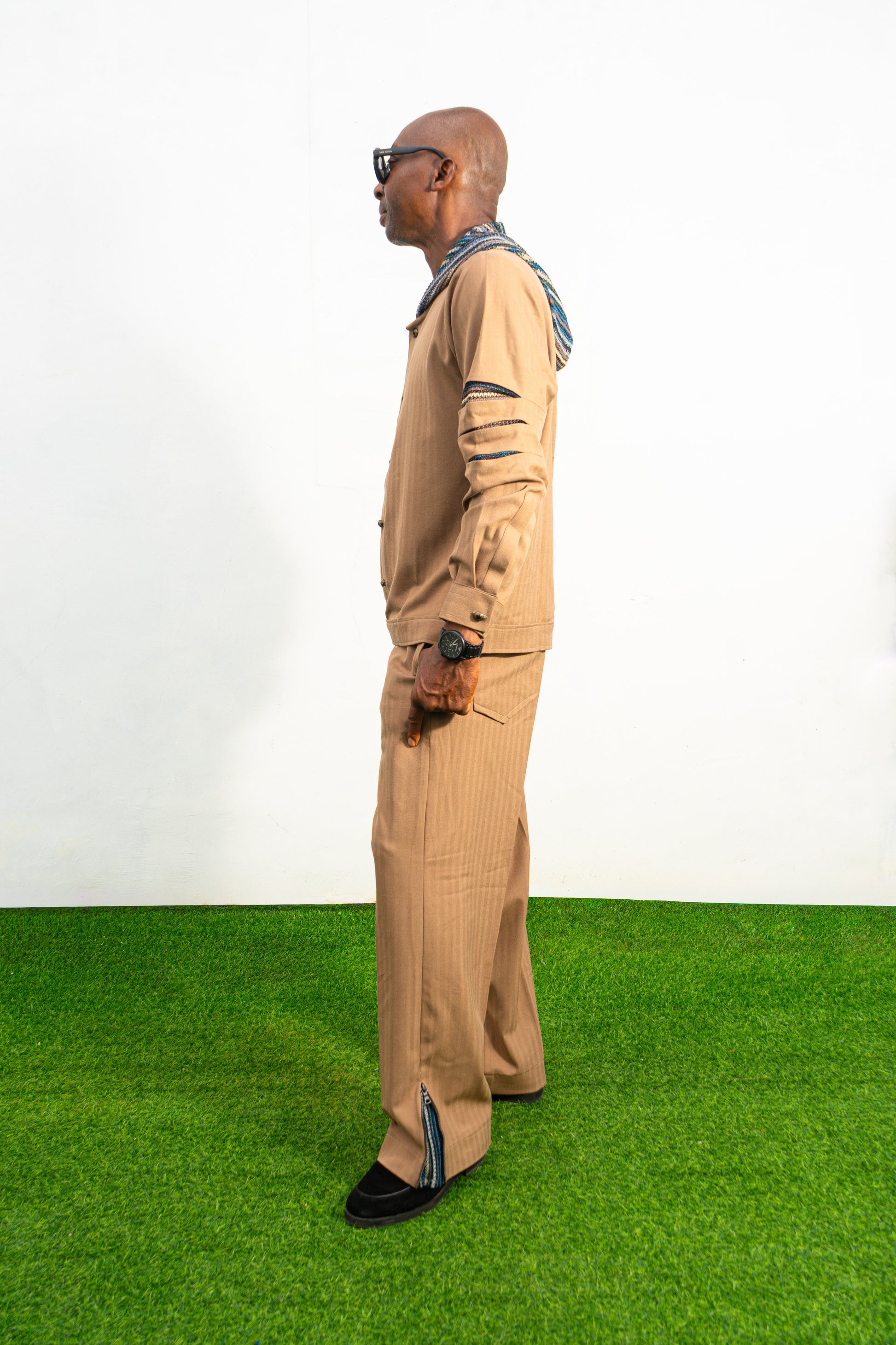 Two-Piece Set featuring a brown long-sleeved hooded shirt with blue patterned sleeve accents and matching straight-leg trousers.