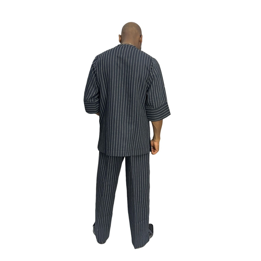 Two-Piece Set featuring a deep blue, white-striped short-sleeved tunic shirt with structured cuffs paired with matching wide-leg pinstripe trousers