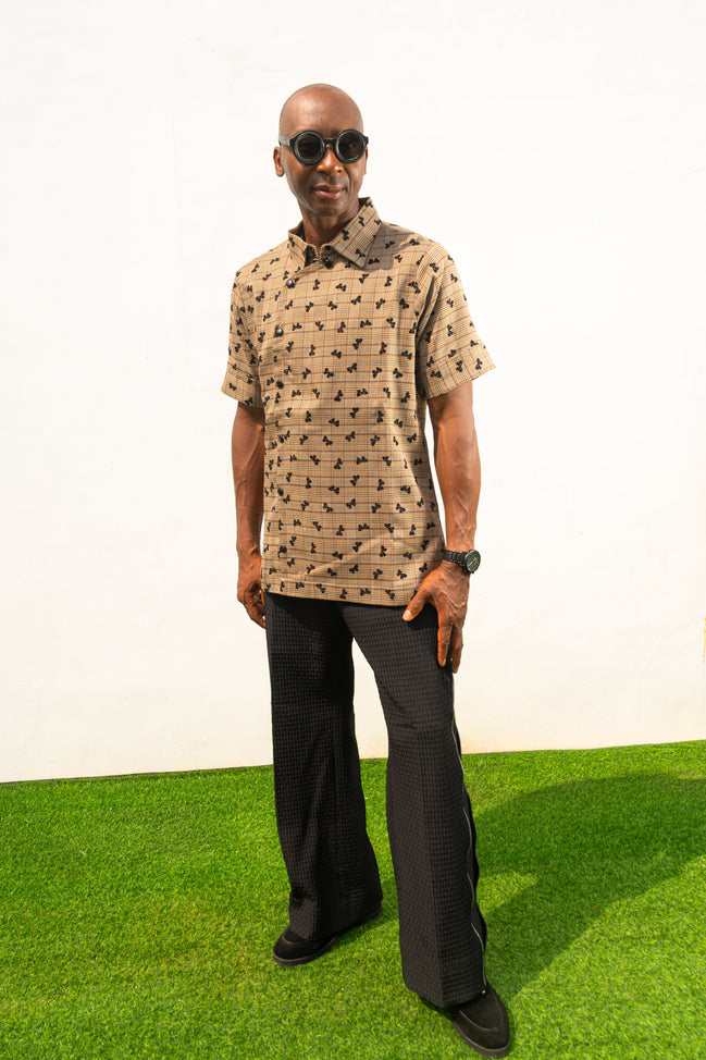 Two-Piece Set featuring a short-sleeved patterned brown shirt with asymmetric buttons and coffee brown corduroy boot-cut trousers.