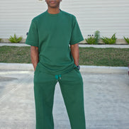 Forest emerald two-piece set featuring a boxy short-sleeved crewneck top and matching wide-leg trousers. -Front View